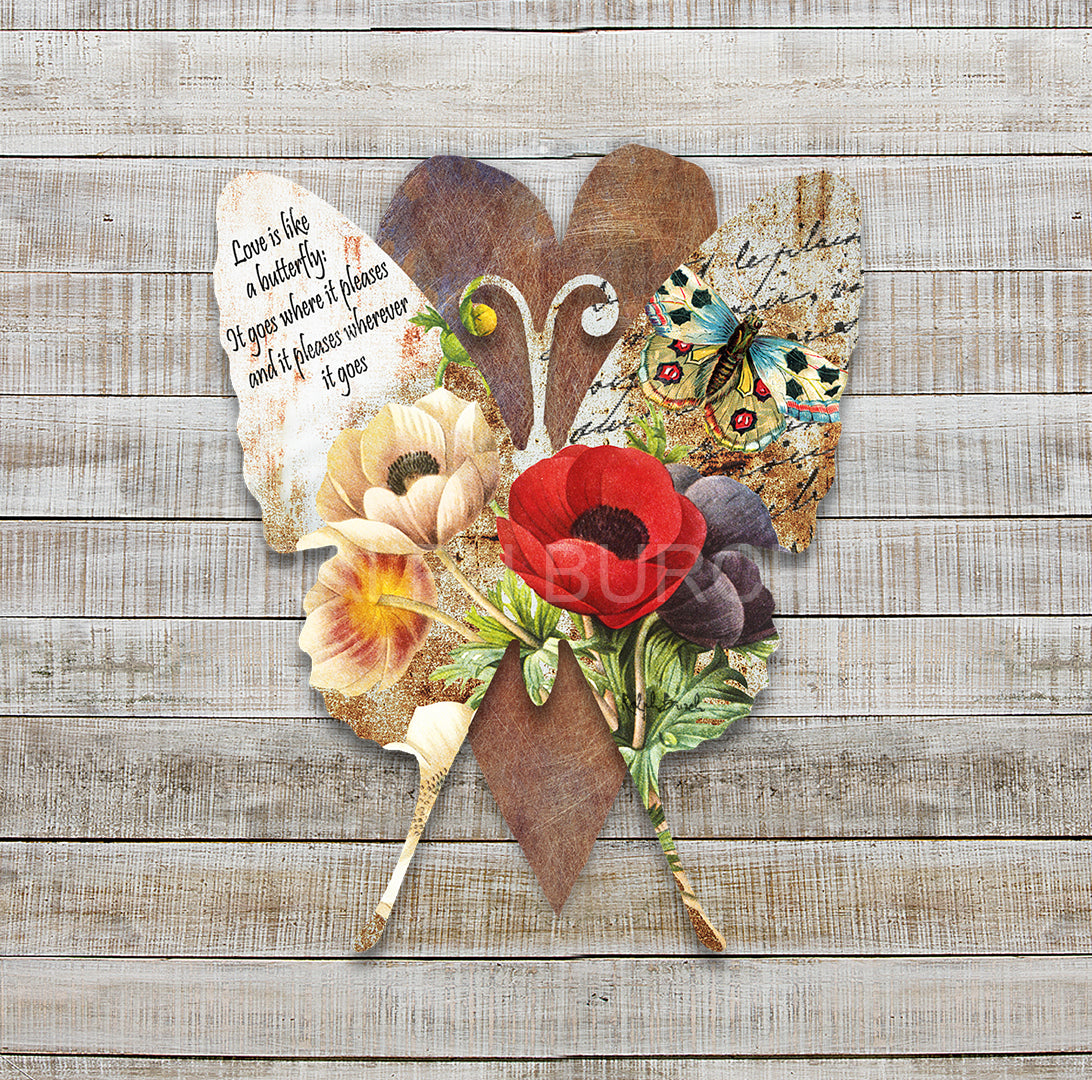 Vintage Butterfly Dimensional Metal Wall Décor by Ralph Burch is pictured here with a background of rust weathered tones. raised and attached to the background heart is a Butterfly shape which has a floral and butterfly image on it. On one wing it say Love is like a Butterfly, It goes where it pleases and pleases where it goes!