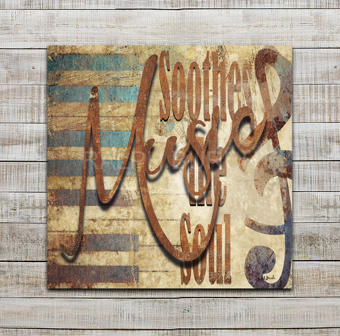Metal background with piano keys in tones of rusts, golden colors and turquois and the words "Soothes the Soul" with the word "Music" in metal raised above the metal background giving it dimension. Music Soothes the Soul Dimensional Metal Wall Decor by Ralph Burch