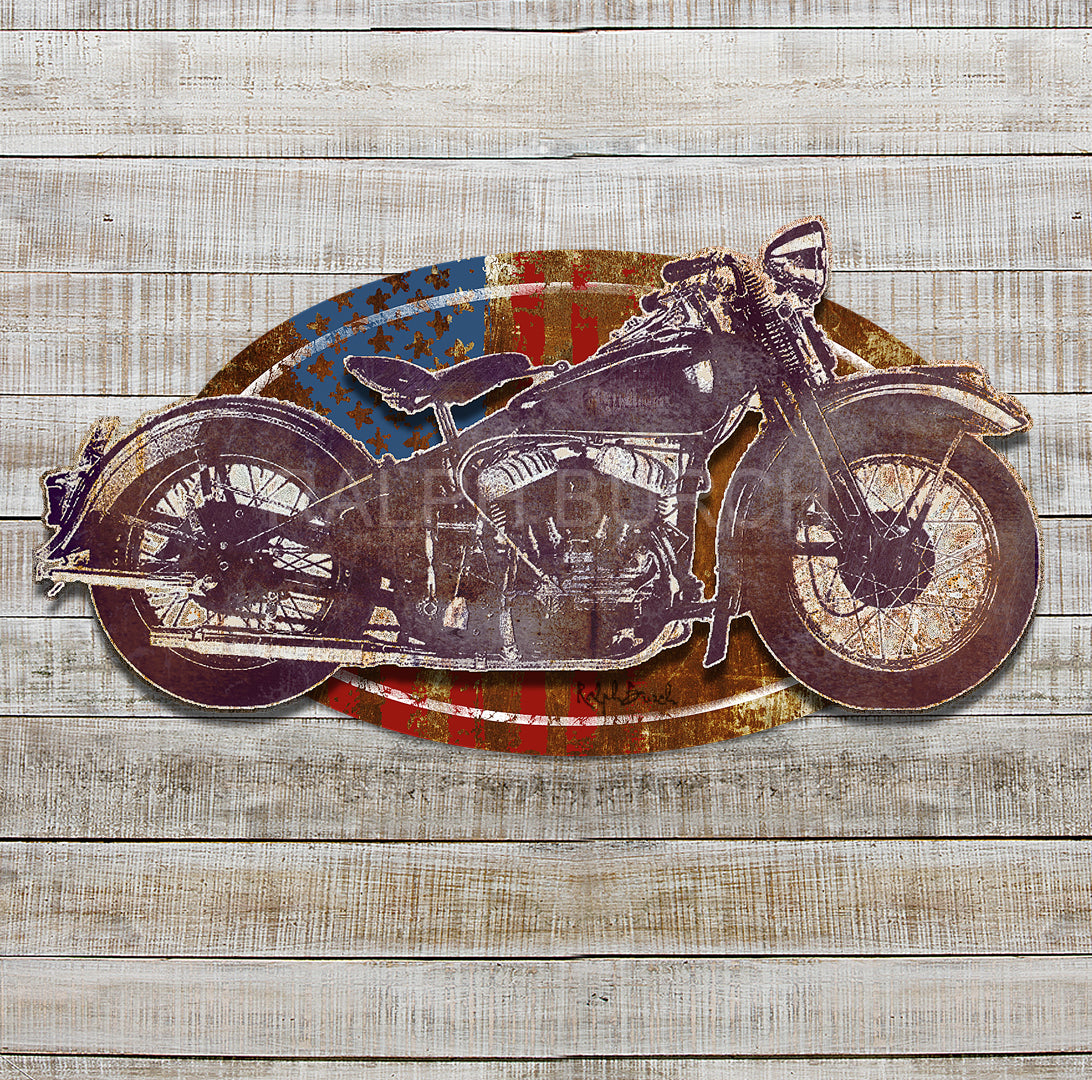 VINTAGE MORTORCYCLE AND FLAG DIMENSIONAL 3D METAL WALL ART by Ralph Burch. Pictured is a vintage motorcycle in weathered deep purple, brownish and whiteish tones. The background for this dimensional piece is an oval rusty tones with an American Flag.