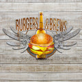 Burgers and Brews Wall Art. 3 pieces with a rustic circle background with the words Burger and Brews attached to the circle at the top and a Hamburger and bottle of Beer with wings that have a variety of beer cap names on the Silver wings