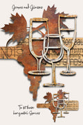 Rustic metal wall art featuring wine glasses, leaves, and a horizontal sign with wine region names like Bordeaux and Chianti, shown on a light beige background.