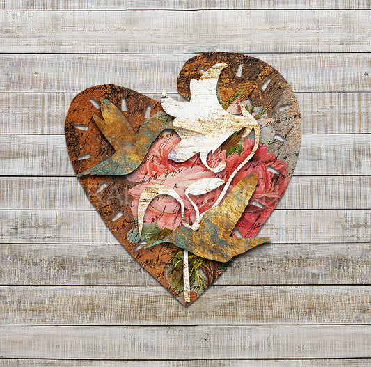 I Love Hummingbirds Dimensional Metal Wall Décor by Ralph Burch. Pictured is a metal layered Heart shaped background with florals and handwriting and weathered rusty tones. Attached to the hearts is rustic white Lilly shape and on top of that are 2 hummingbird shapes in goldish tones and blueish green tones.