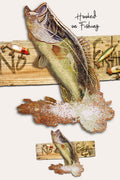 Fishing-themed wall decor featuring two mounted fish cutouts with salt-crystal effects, small fishing lures, and the words 'Hooked on Fishing' on a light beige background.