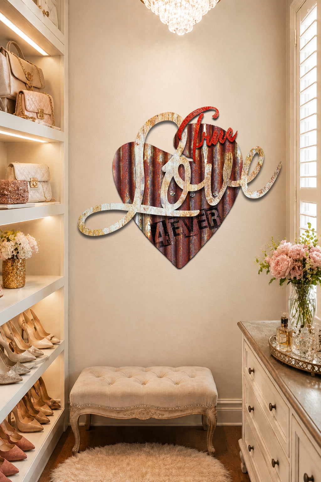 A decorative wall sign shaped like a heart with the words 'True Love Never' in stylized lettering, displayed in a boutique entryway above a tufted bench.