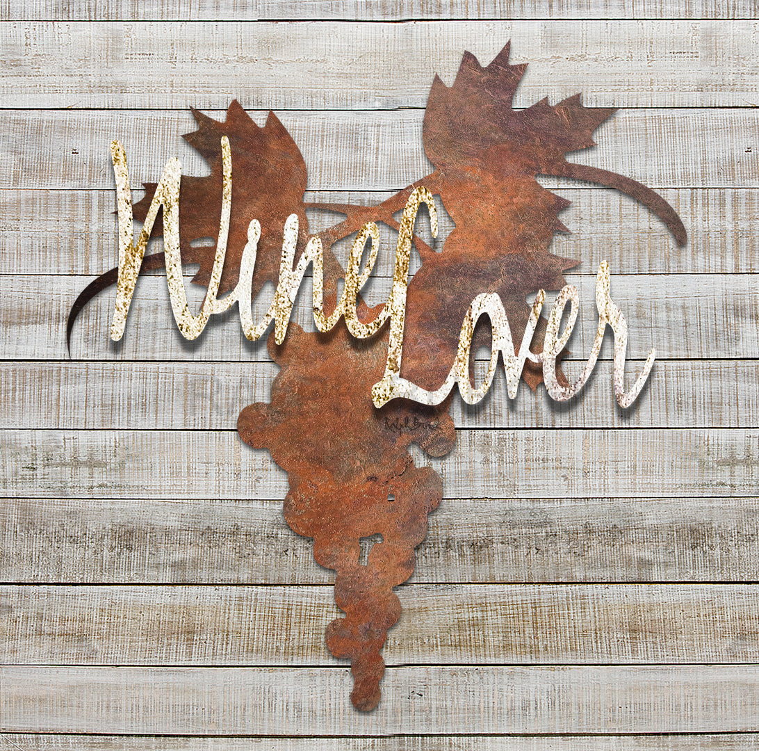 Wine Lover metal wall art by Ralph Burch shows a background of Grapes and Leaves in rusty tones. Attaced and raised for dimension, are the words "Wine Lover" in a rusty white tones. The perfect dimensional wall art for your wine cellar home bar or restaurant.