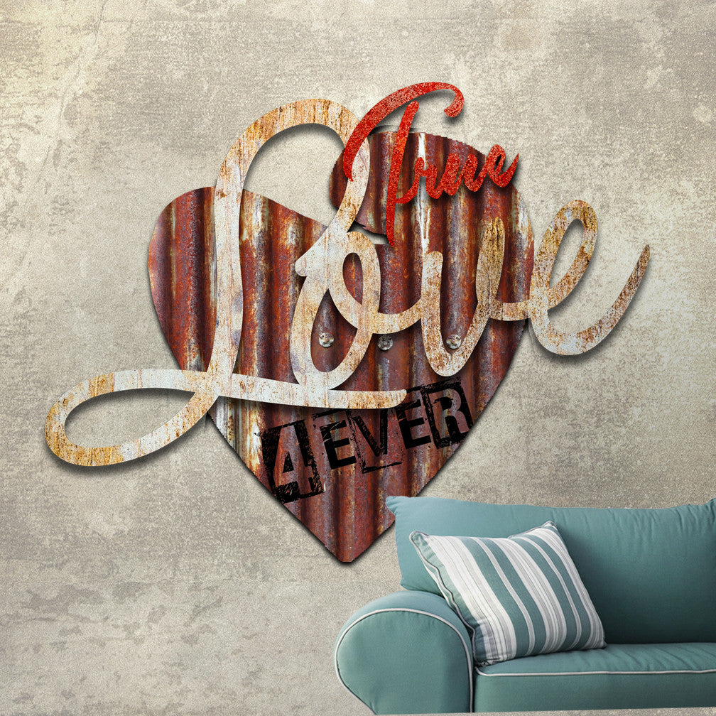 TRUE LOVE 4 EVER Dimensional Vintage Metal Wall Décor by Ralph Burch shows a background layer of a Heart in Rusty Corrugated looking metal with 4ever stamped on it.  Attached to the heart is the word Love in a whiteish rusty tone and also over the word Love is the word True in a reddish tone completing the 3 layered dimensional look.