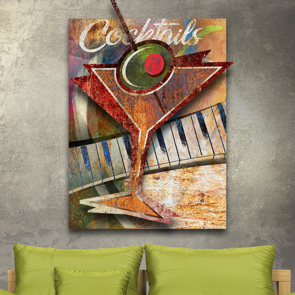 Cocktails Dimensional Wall Décor by Ralph Burch shows an abstract Metal background with vintage rusty tone with a abstract piano keyboard. Mounted to that is a abstract cocktail glass with olive and cocktail toothpick.